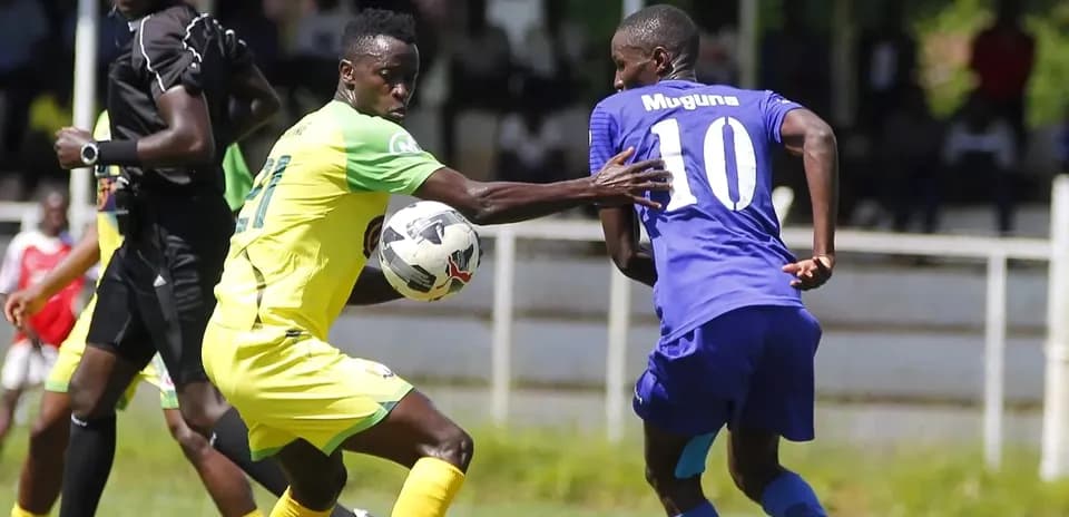 Shabana player challenging KCB player for the ball