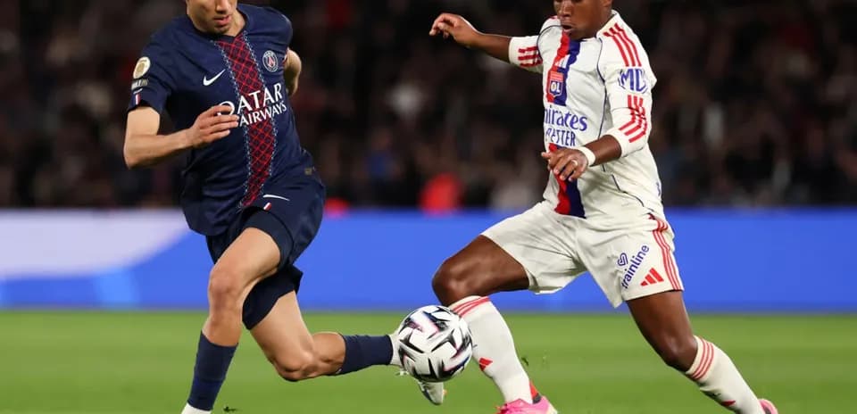 Two players competing for the ball during match