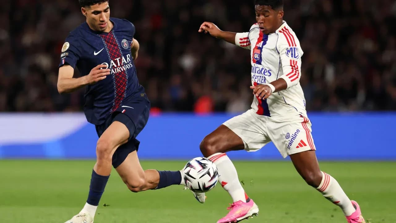 Two players competing for the ball during match