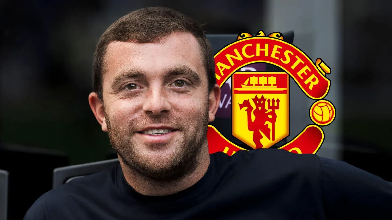 Man smiling with Manchester United logo background