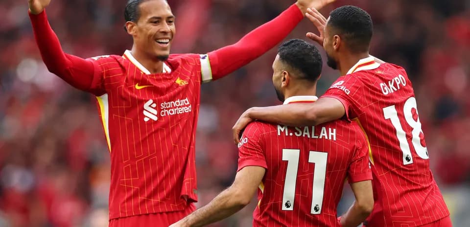 Liverpool players celebrating a goal during match