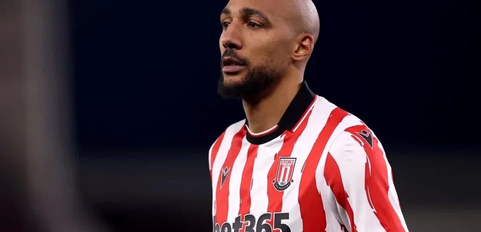 Player in red and white striped jersey during match