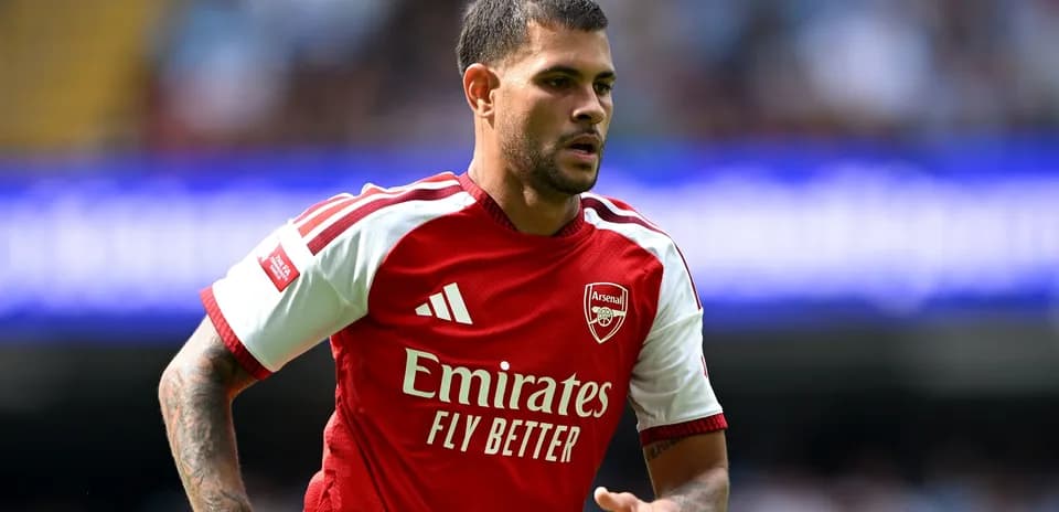 Player wearing Arsenal jersey during match action