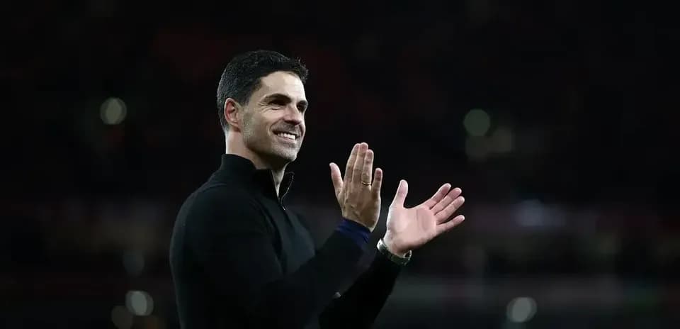 Manager applauding fans during match celebration