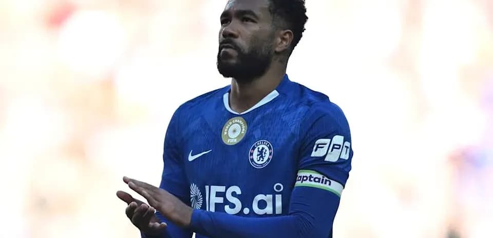 Player in blue jersey with captain's armband