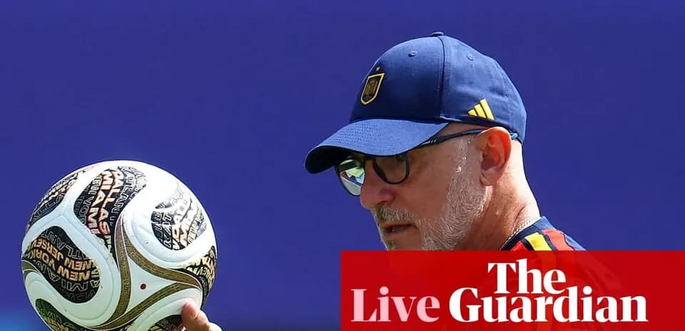 Coach holding a football during training session