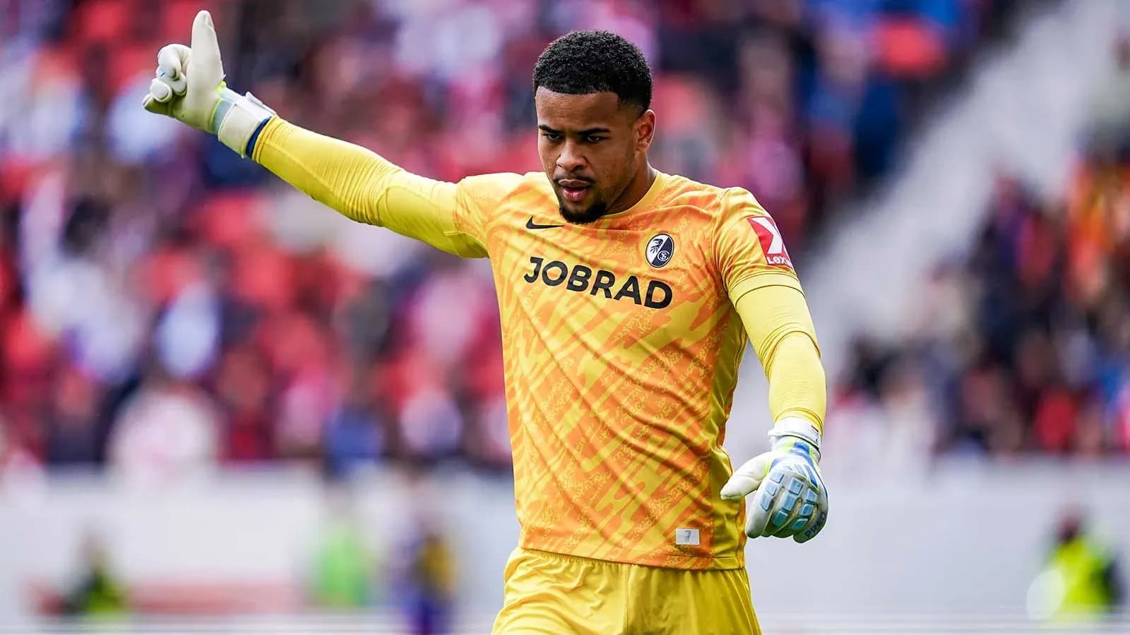 Goalkeeper signaling during a football match