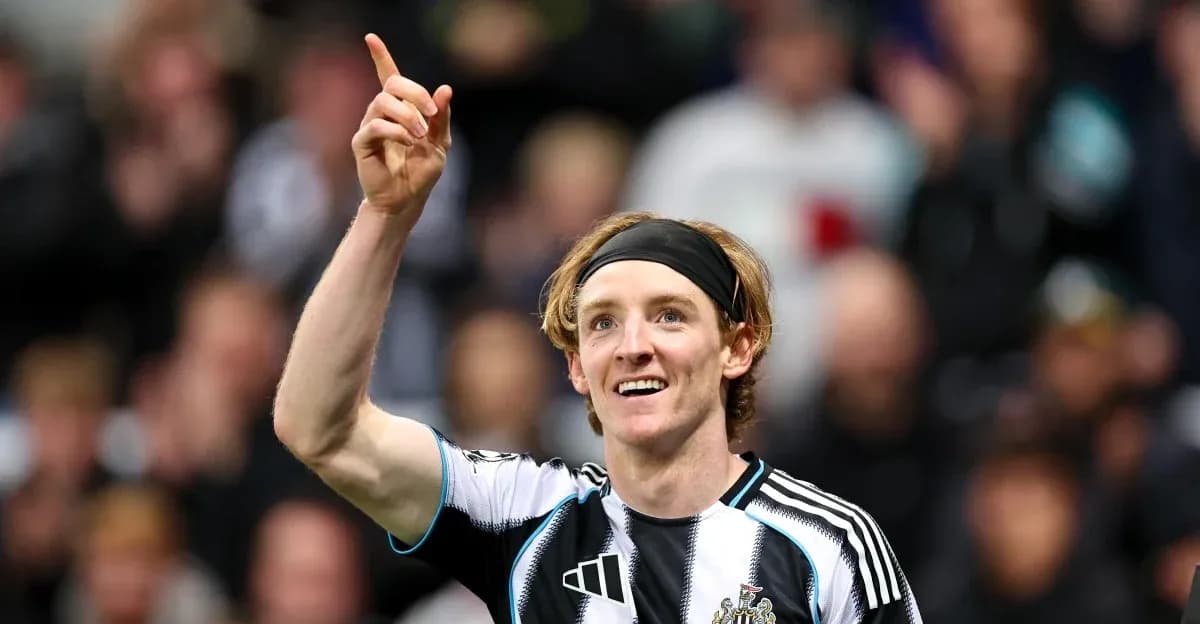 Newcastle player celebrating and pointing after scoring