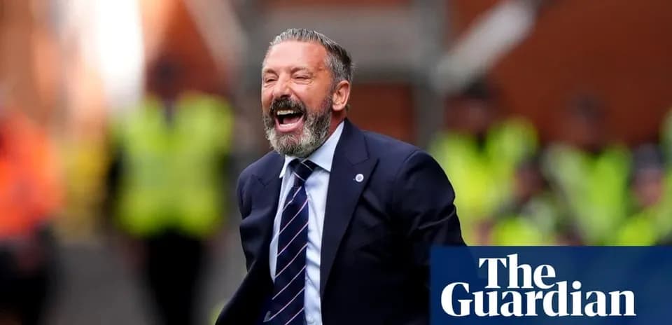 Manager celebrating passionately on the sidelines