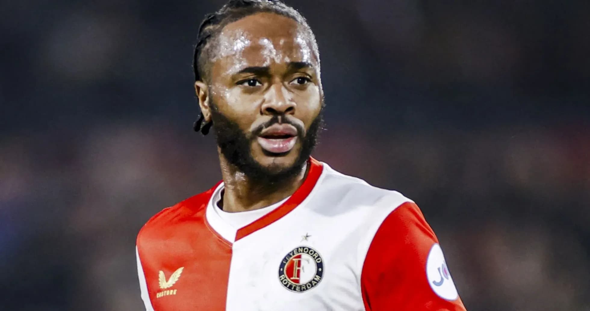Feyenoord player in red and white kit during match