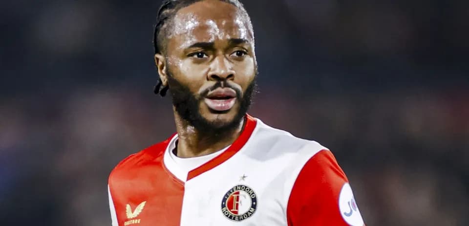 Feyenoord player in red and white kit during match