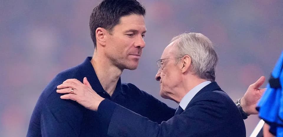 Two men embracing at a sports event