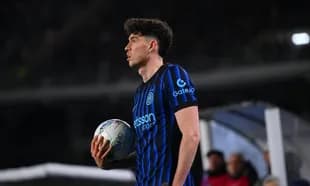 Player holding ball during match at stadium