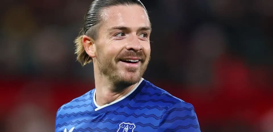 Player smiling in Everton jersey during match
