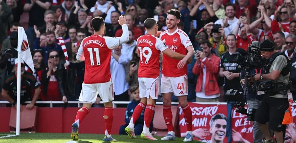 Arsenal players celebrating a goal at home