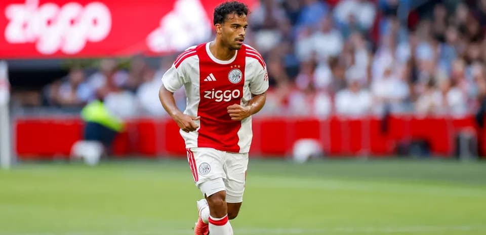 Player in Ajax kit running with the ball