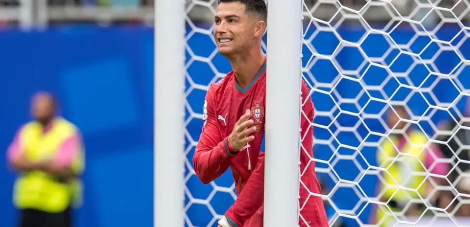 Player in red jersey near goalpost during match