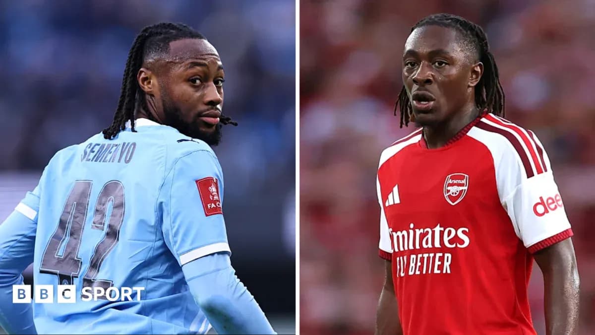 Two football players in team kits facing opposite directions