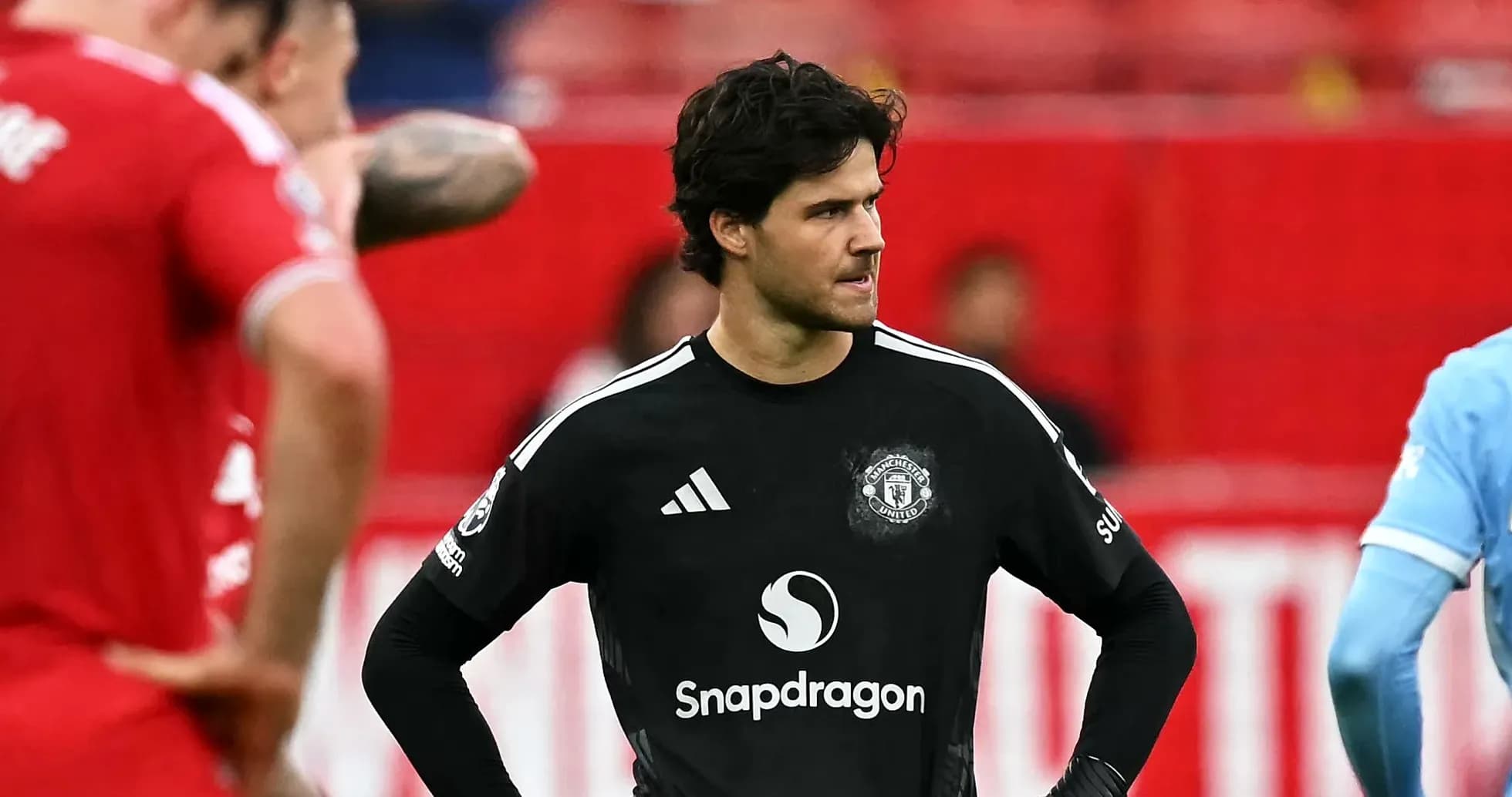 Goalkeeper in black kit during match action