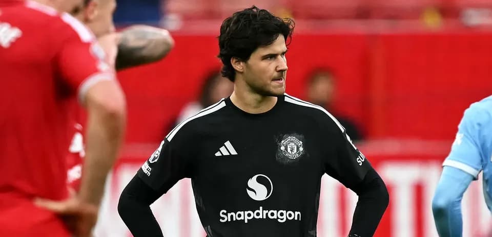 Goalkeeper in black kit during match action