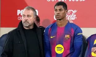 Coach and player discussing during match substitution