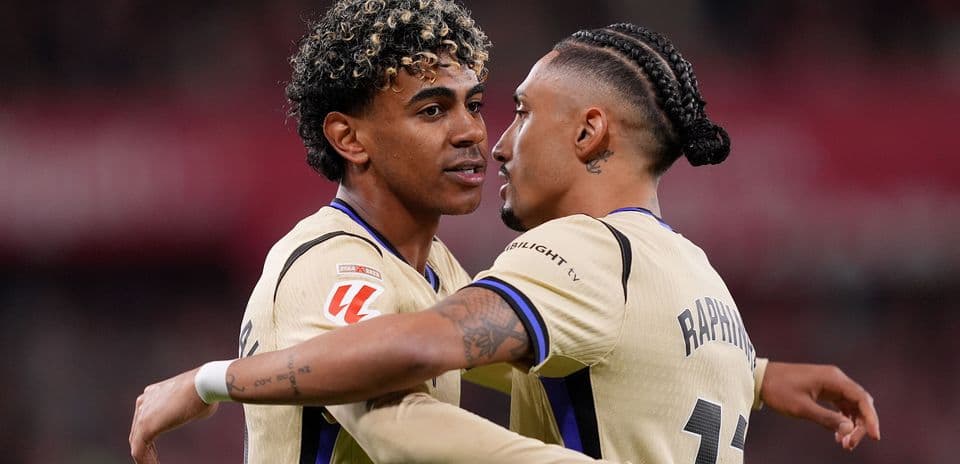 Two players embracing on the field during match