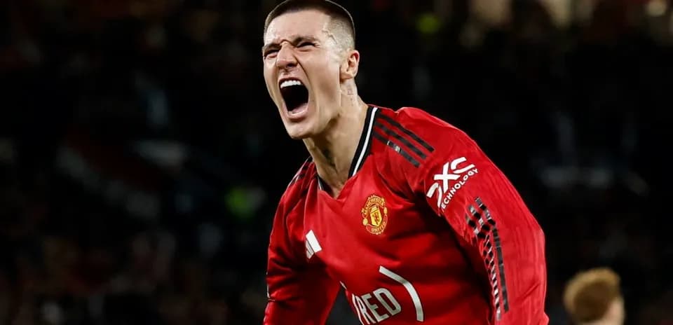 Player celebrating a goal in Manchester United jersey