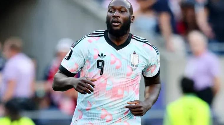 Player wearing Belgium kit running on the pitch