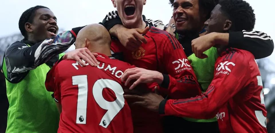Manchester United players celebrating a goal