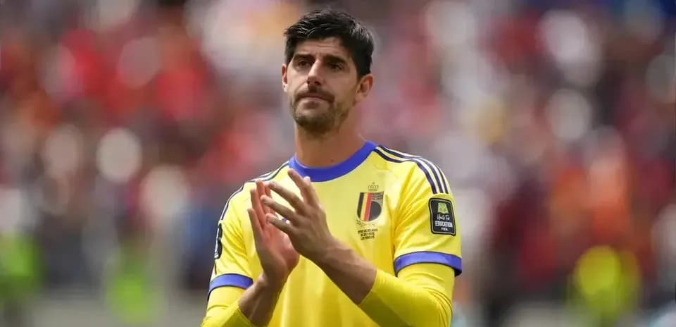Goalkeeper clapping in yellow kit during match
