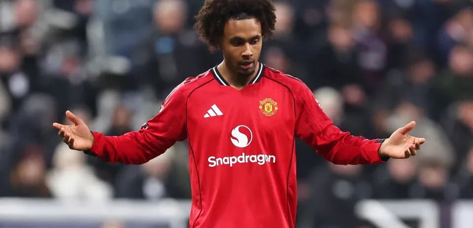 Player in red Manchester United jersey on the field
