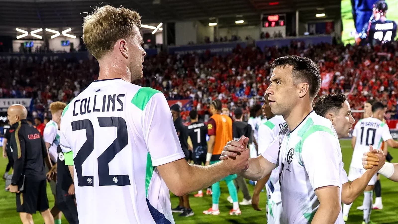 Players shaking hands after a match on field