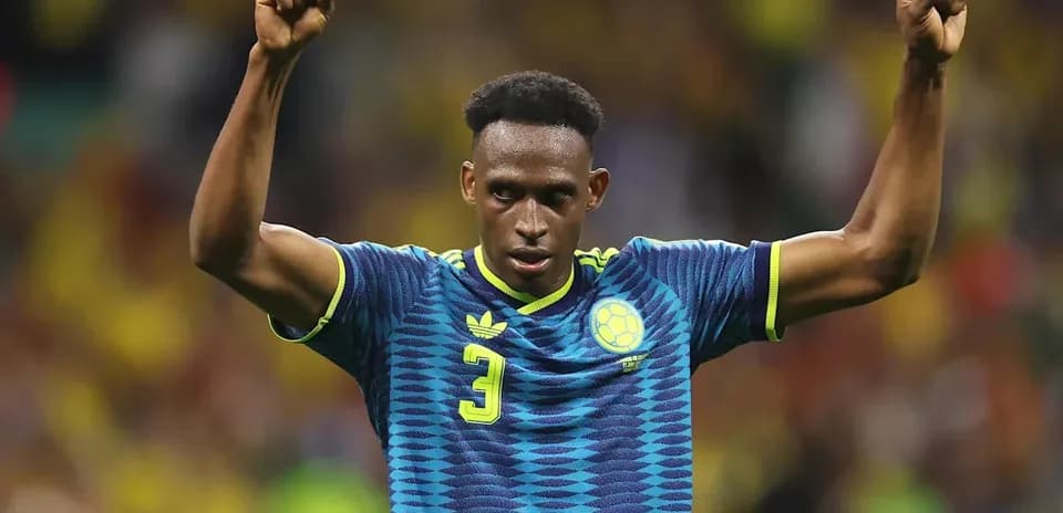 Player celebrating with raised fists on field