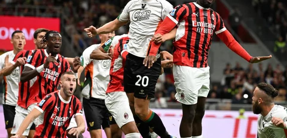 Players contesting for the ball in Serie A match