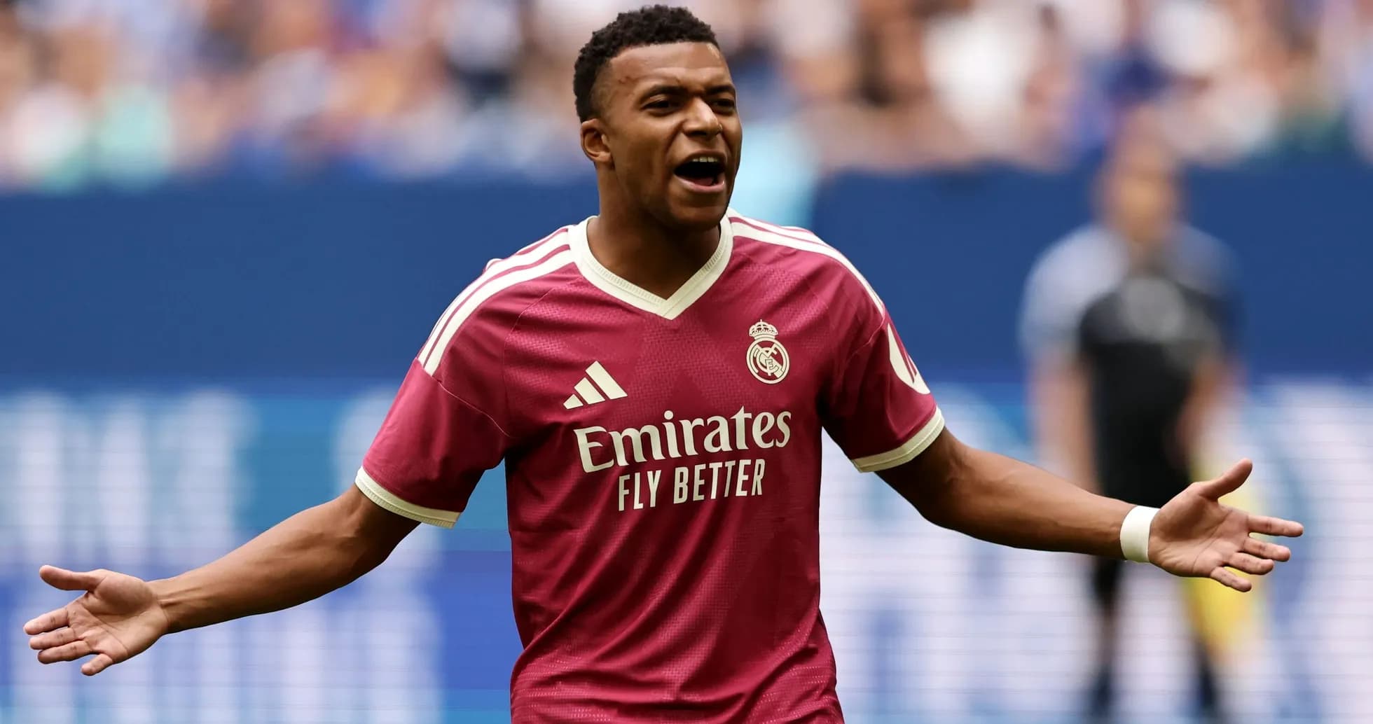 Player celebrating in pink Real Madrid jersey