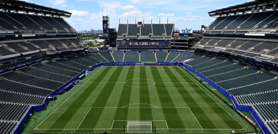 Empty stadium with soccer field and seating areas