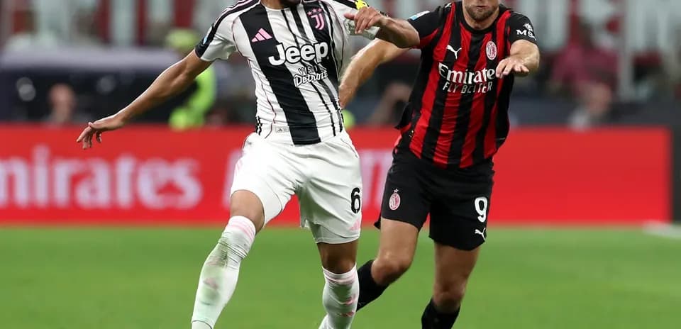 Juventus player challenges AC Milan opponent for ball