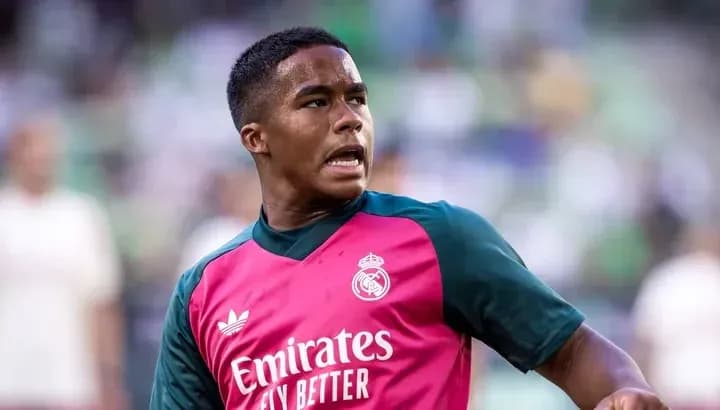 Player in Real Madrid training kit on pitch