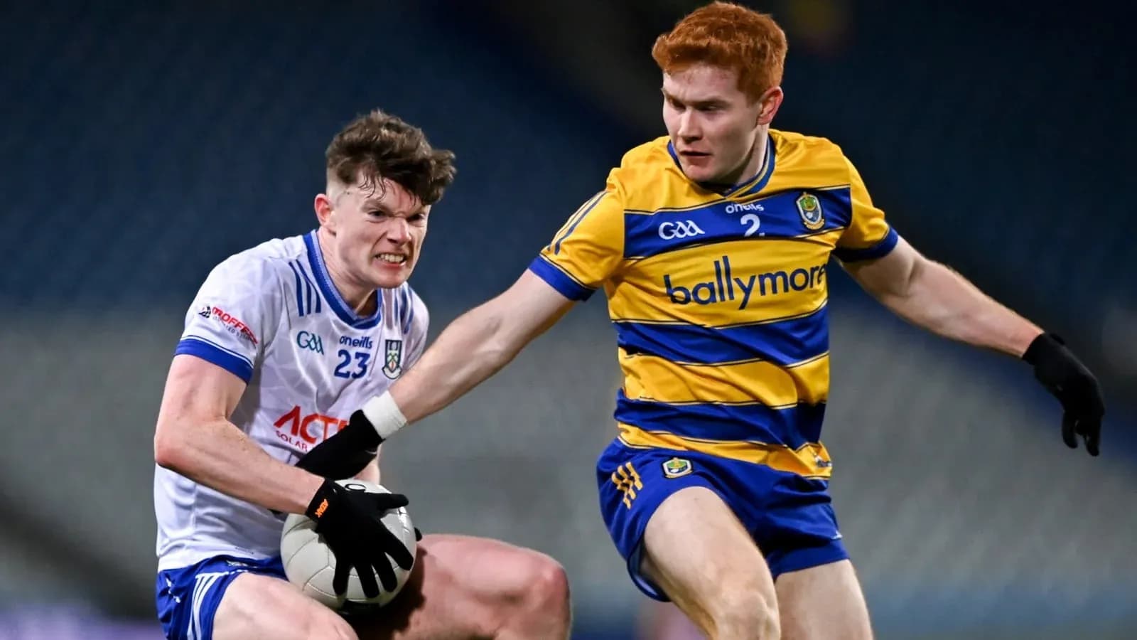 Two players contesting for a Gaelic football