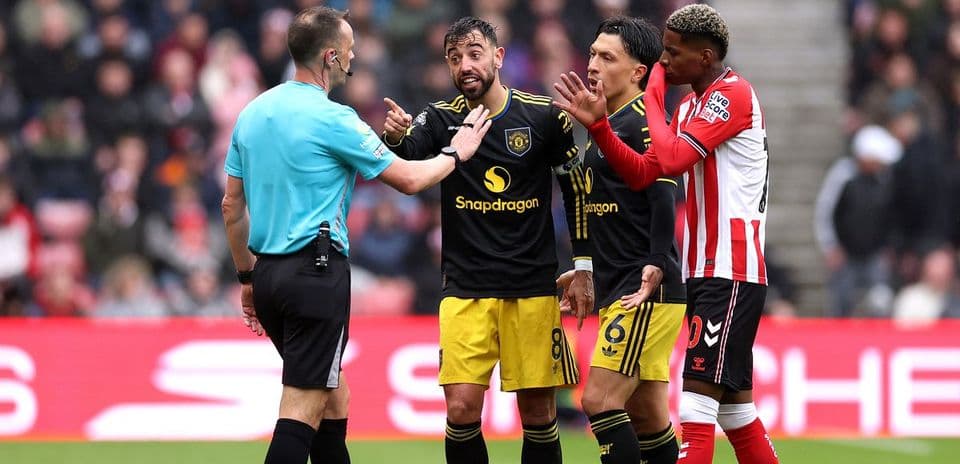 Players discussing with referee during a match
