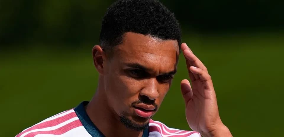 Player touching forehead during training session