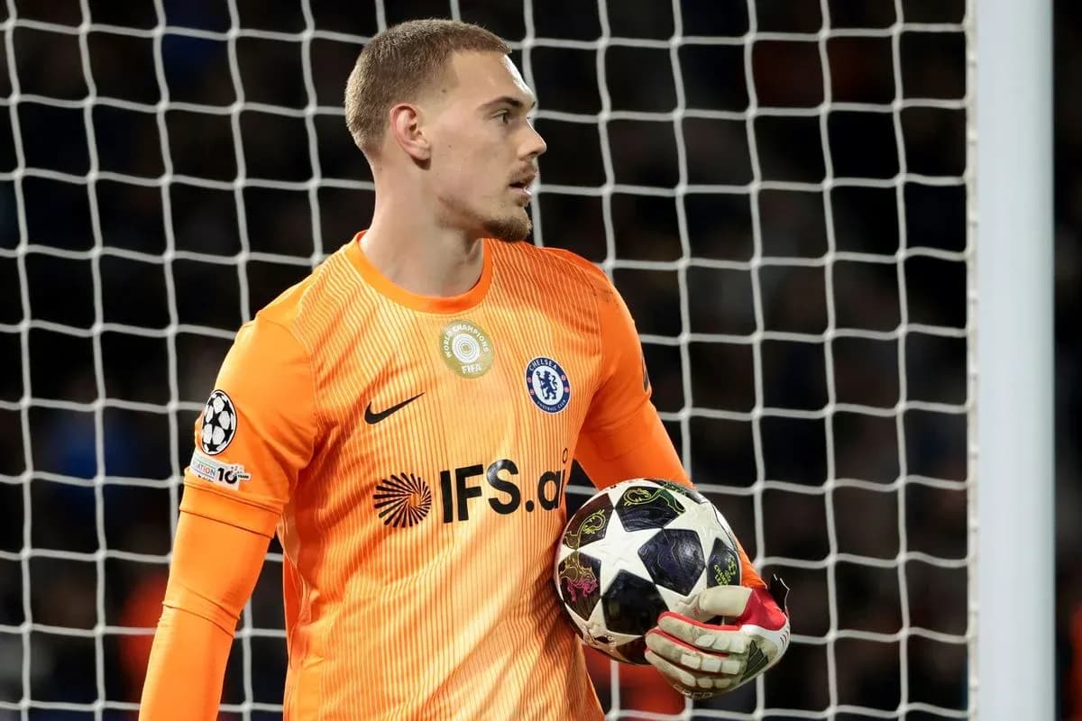 Chelsea goalkeeper holding UEFA Champions League ball