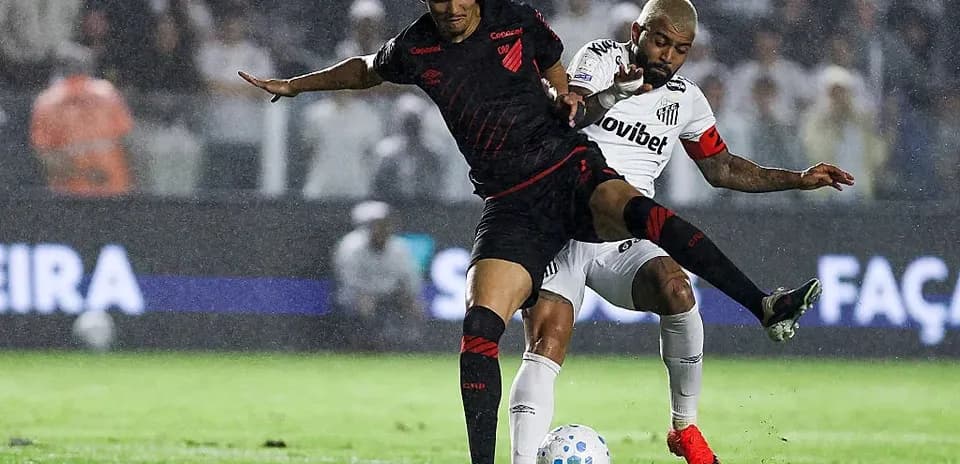 Two players battling for the ball during match