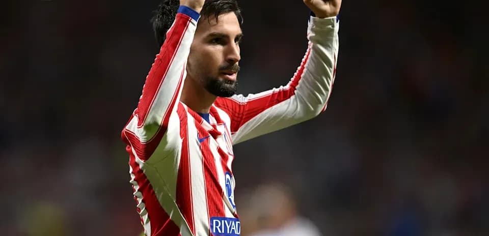 Player celebrating with raised arms on the field