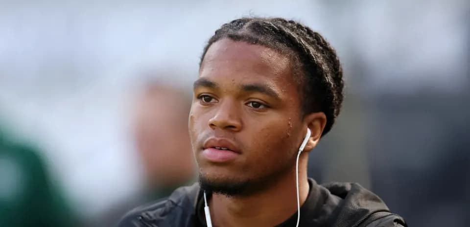 Player wearing headphones before the match