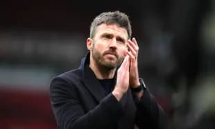 Coach applauding fans after match