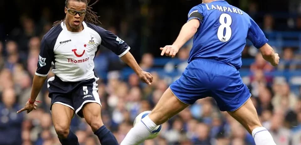 Player evading tackle during Premier League match