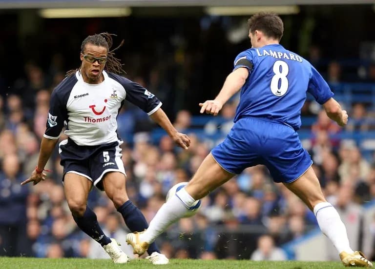 Player evading tackle during Premier League match