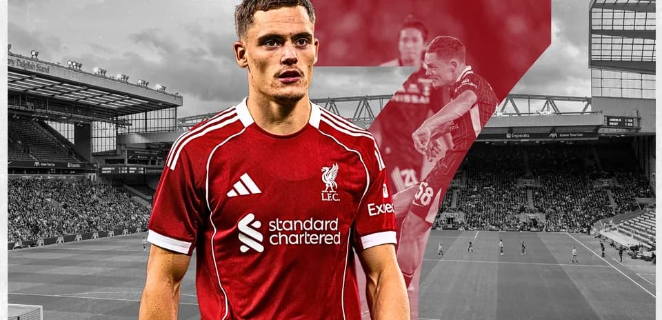 Liverpool player posing at Anfield stadium