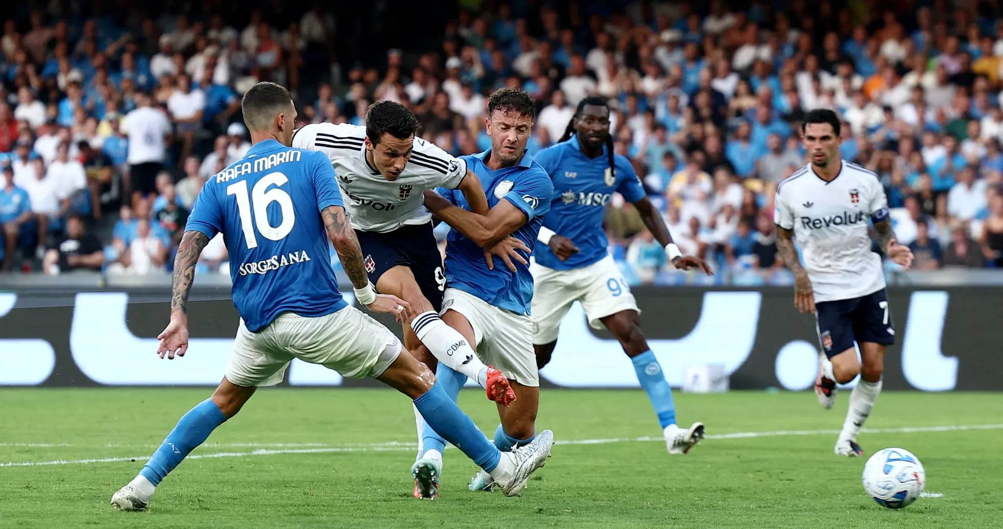Players competing for the ball in Serie A match